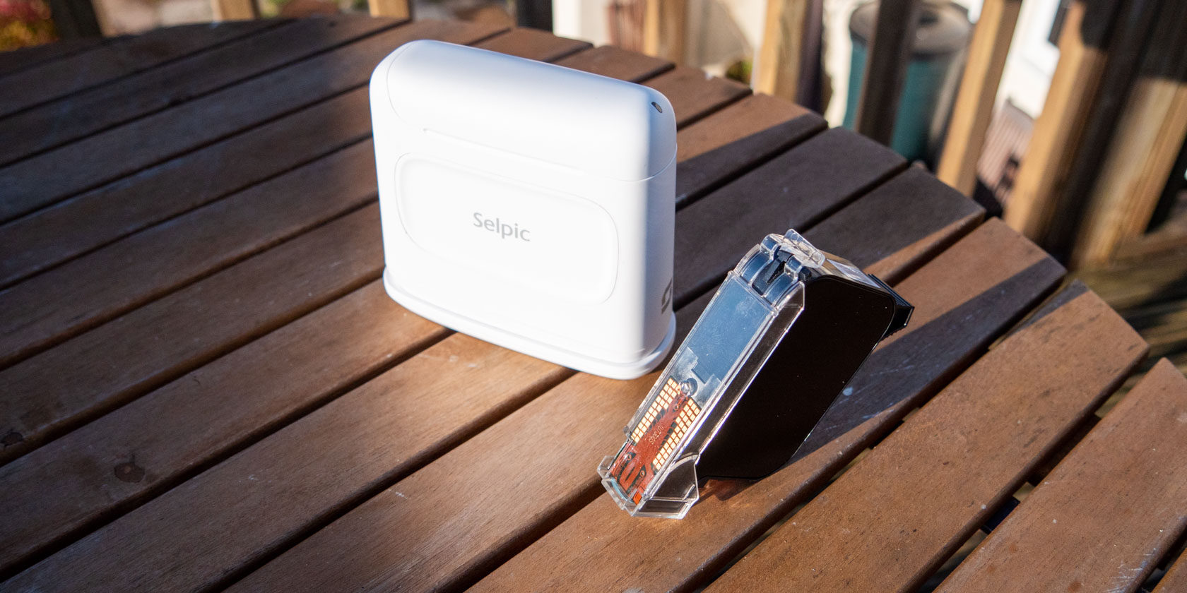 Selpic S1 portable printer and spare print cartridge